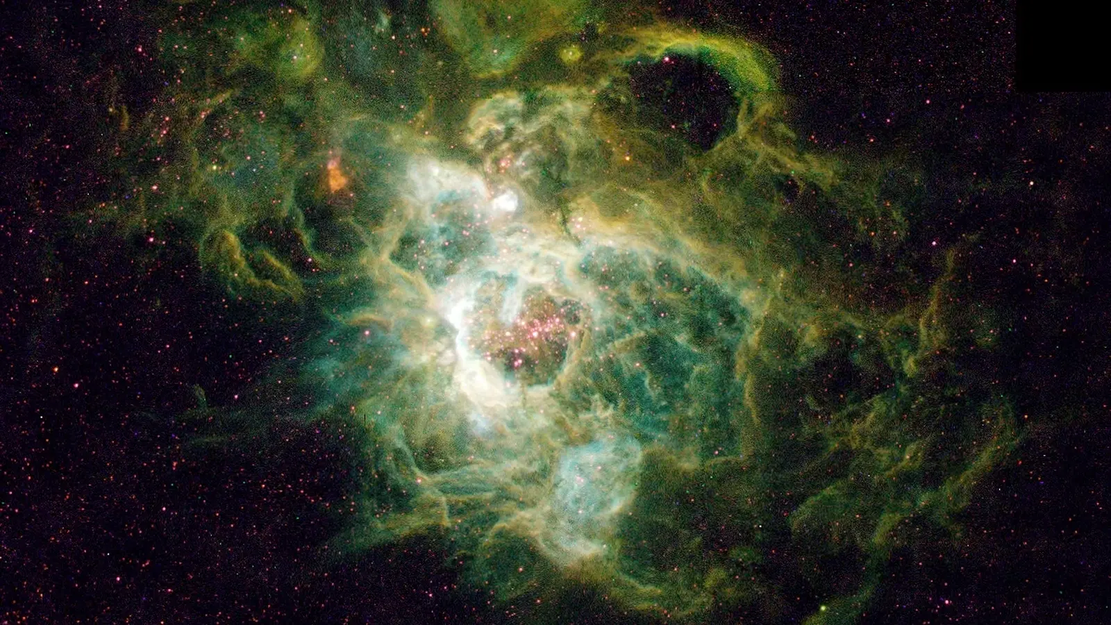 Εικόνα από το Διαστημικό Τηλεσκόπιο Hubble ενός τεράστιου νεφελώματος που ονομάζεται NGC 604, το οποίο είναι πλούσιο σε ήλιο